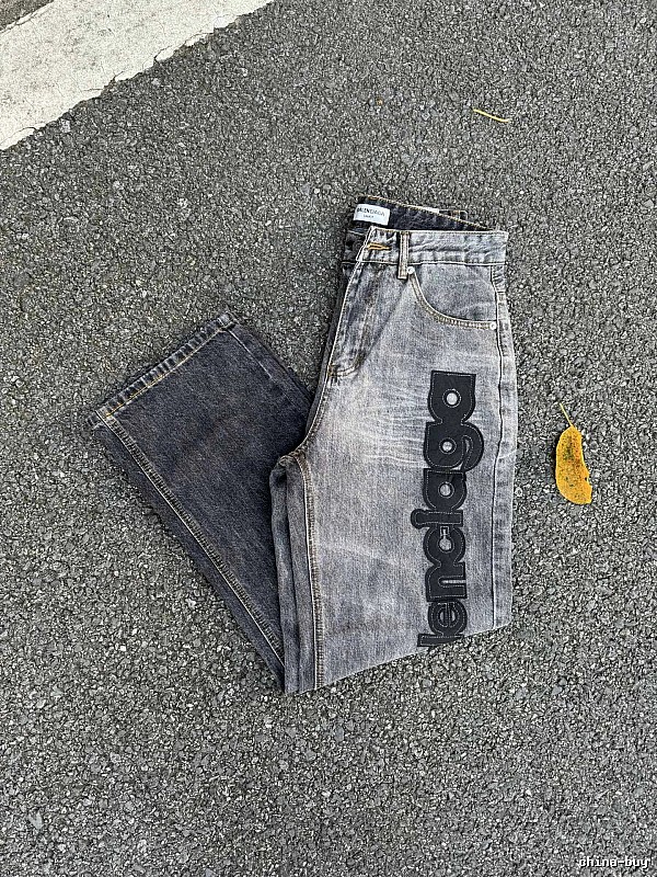 Balenciaga Logo Jeans with large side script branding and a faded leg in Gray Wash