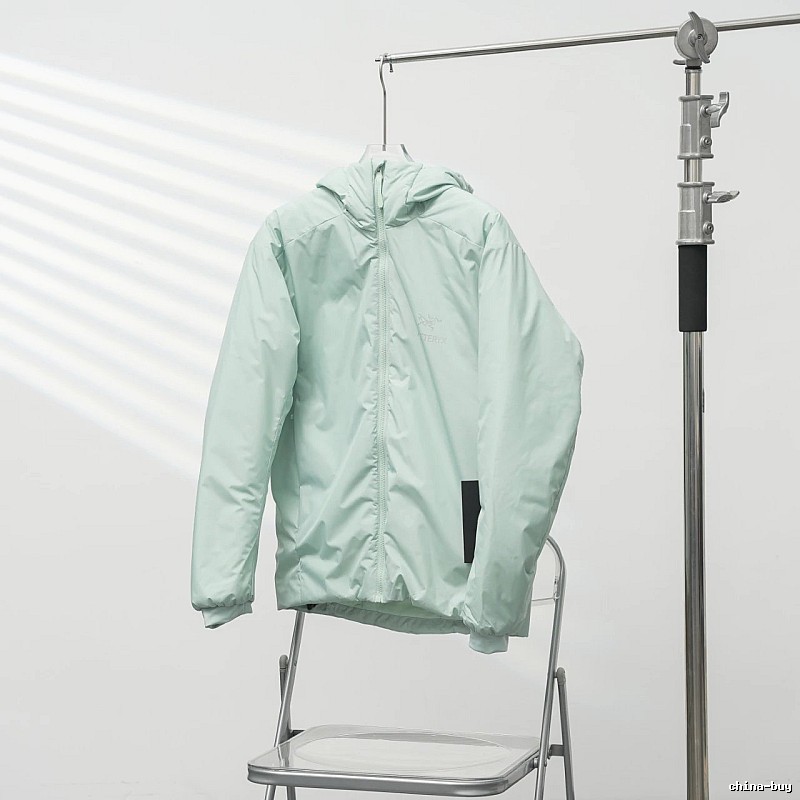 Clean Hooded Profile And Minimal Chest Branding Arc'teryx Lightweight Shell Jacket in Mint Green