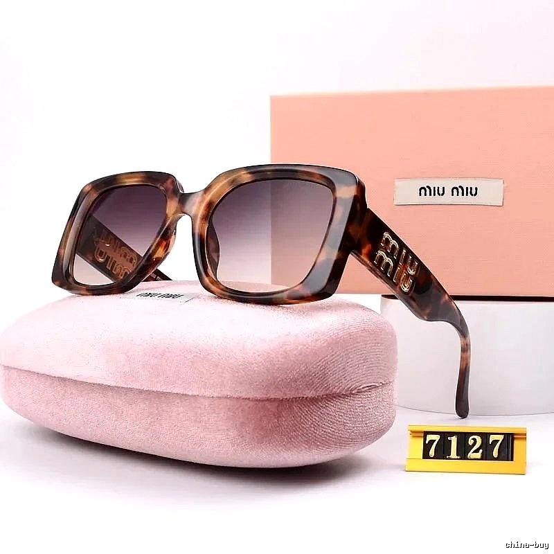 Miu Miu Relaxed Oversized sunglasses Black Oval Sunglasses with Designer-Inspired Detail