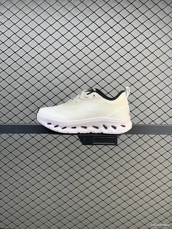 On Cloud Runners in White and Black, Finished with Layered Mesh Upper