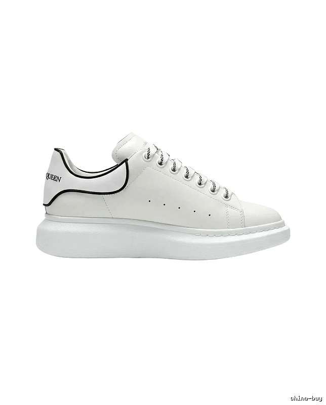 The minimalist style of McQueen white sneakers.
